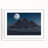 Extra large abstract art print depicting textured pyramids, in muted earth tones, framed in white.