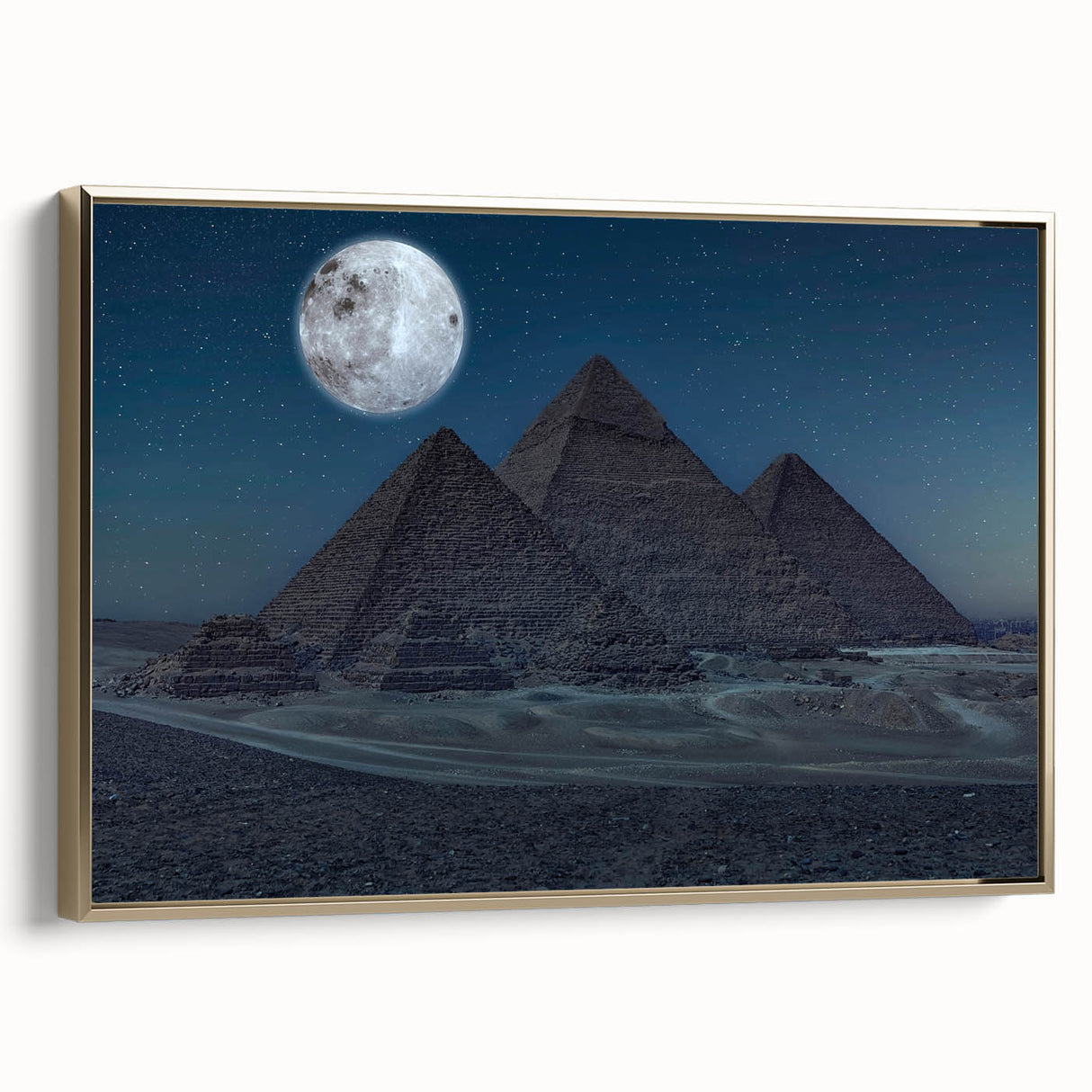 Framed canvas depicting a vintage-style landscape art painting of pyramids, in muted gold and black tones.