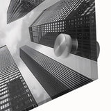 Mid-century modernist skyscraper design in muted gray tones on large acrylic glass, ideal for dining room art.