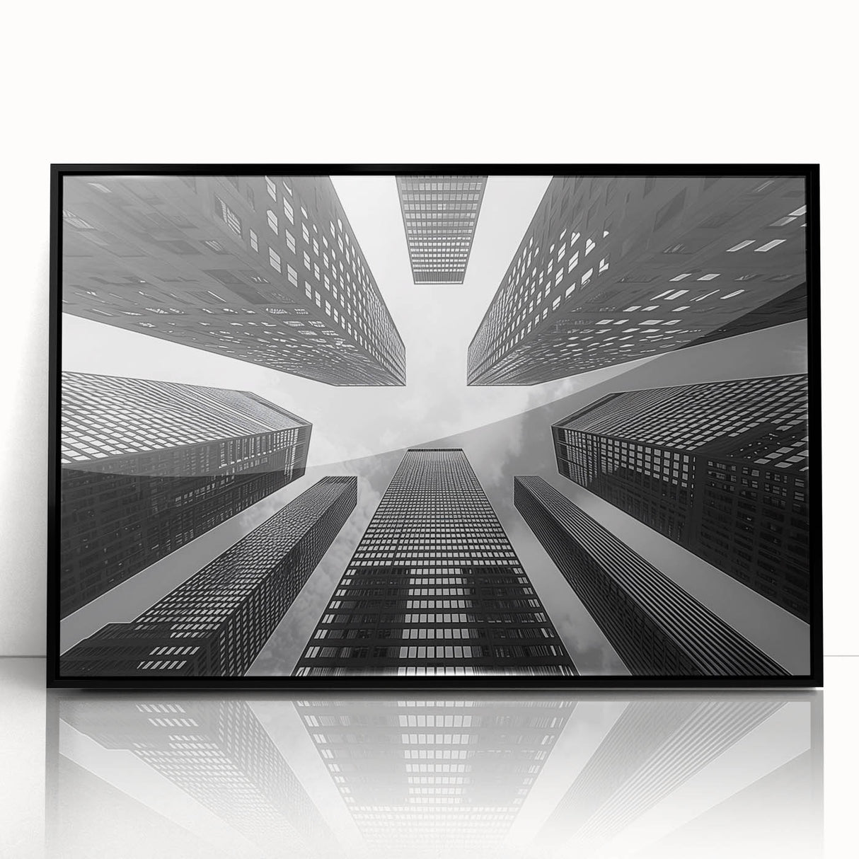 Large abstract wall art depicting a skyscraper in black and white tones on a framed acrylic.