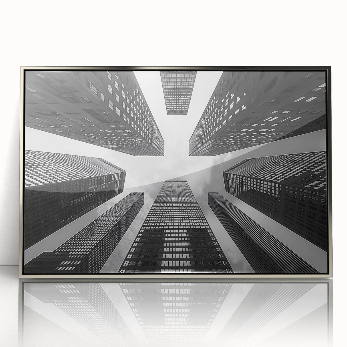 Silver-framed acrylic print of an art deco skyscraper design in monochrome, suitable for modern art wall decor.