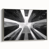 Vintage poster art of a skyscraper in silver frame, featuring a black and colorful palette, ideal for living room decor.