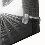 Large abstract wall art featuring mid-century modernist skyscrapers in muted gray and blue tones, acrylic print.