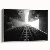 Vintage poster art of a skyscraper, featuring a monochrome palette with silver highlights, framed canvas.