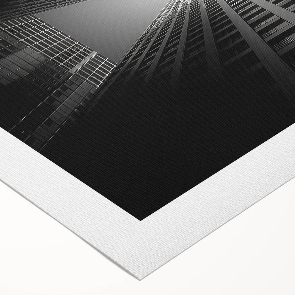Art deco poster featuring a stylized skyscraper in monochrome tones on rolled canvas.