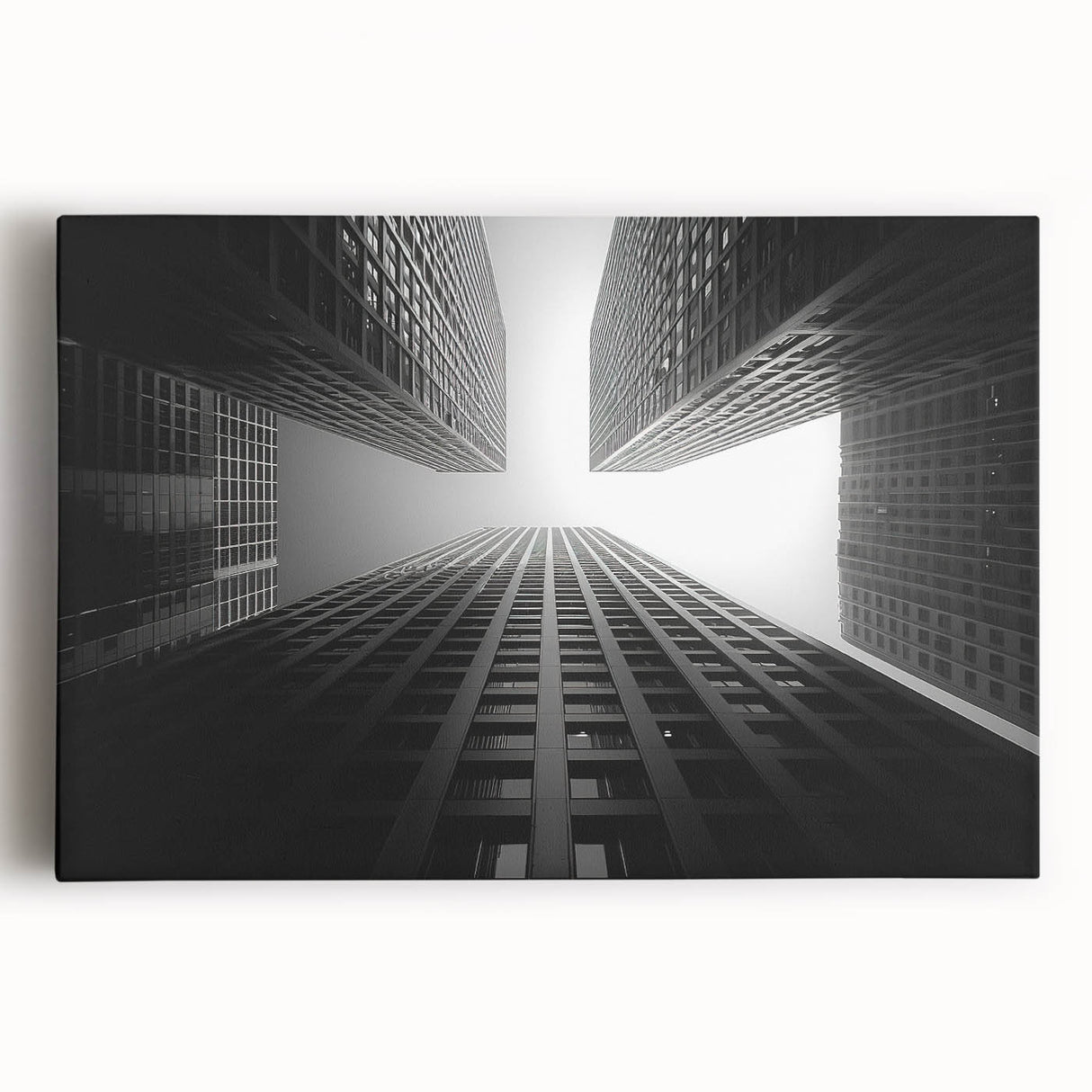 Black and white photo of a skyscraper on stretched canvas, ideal for kitchen wall art.