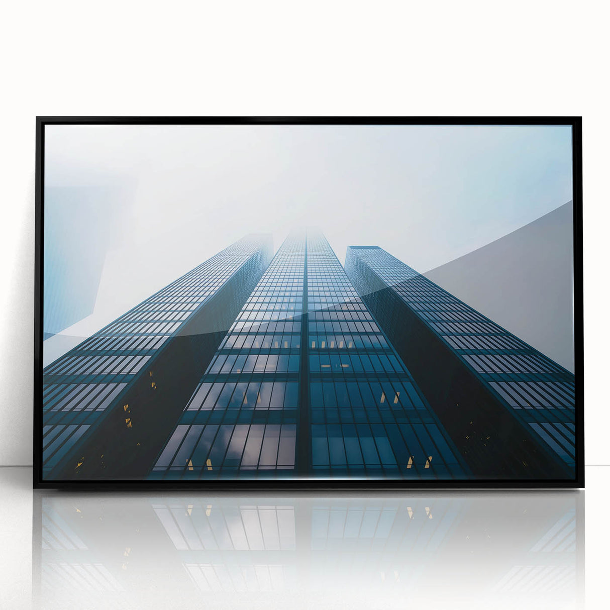 Large abstract wall art of skyscrapers in black and gray tones on acrylic, ideal for modern office decor.