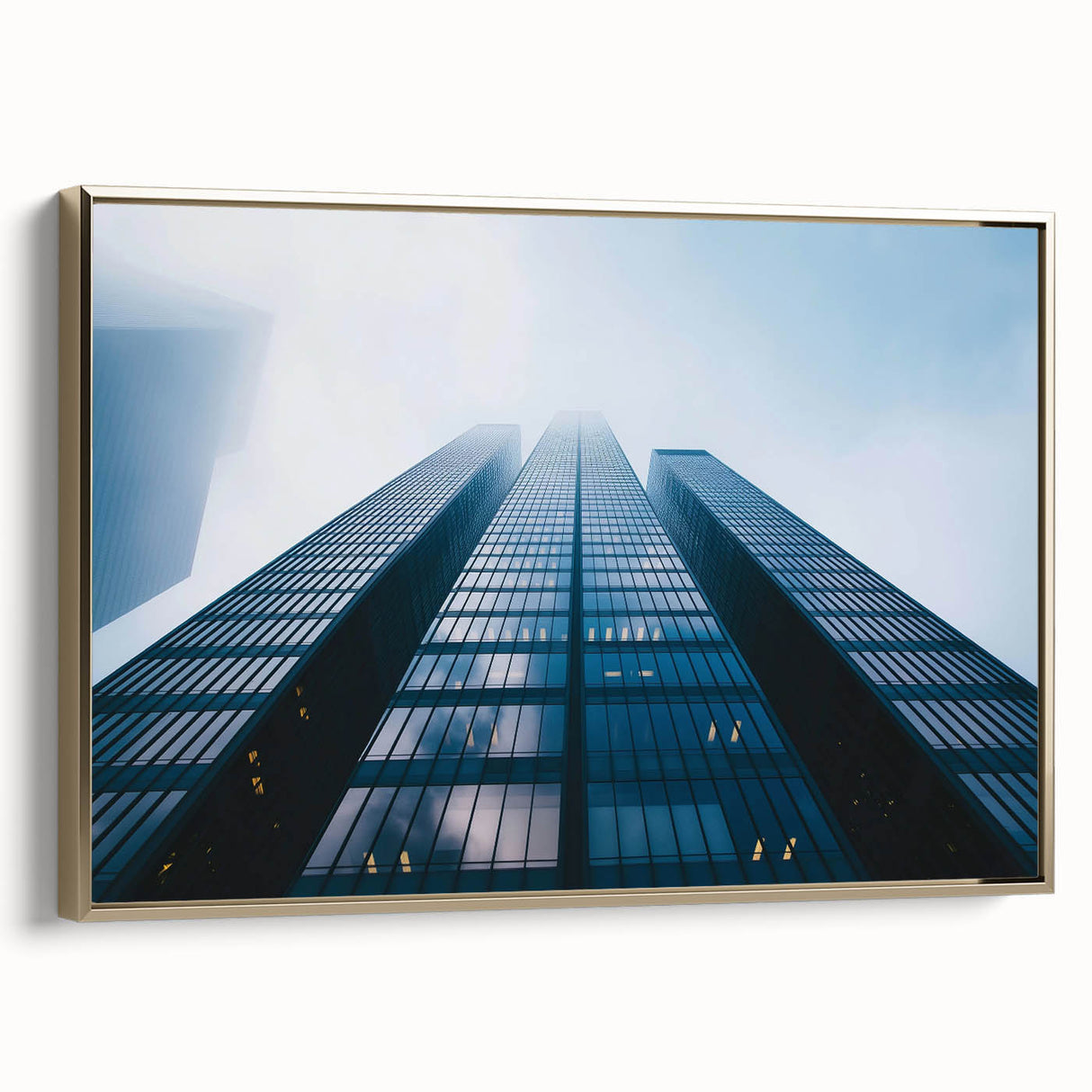 Framed canvas featuring a vintage poster of a black skyscraper with colorful accents, ideal for office decor.