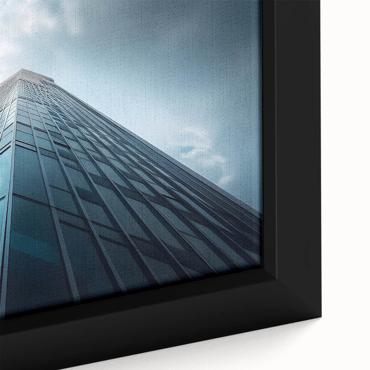 Extra large framed canvas featuring a close-up of a black skyscraper with colorful, textured accents.