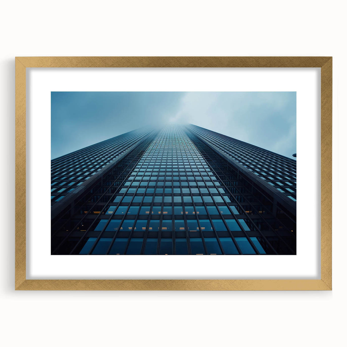 Textured art of abstract skyscraper design in muted gray, framed in gold, ideal for modern bedroom decor.