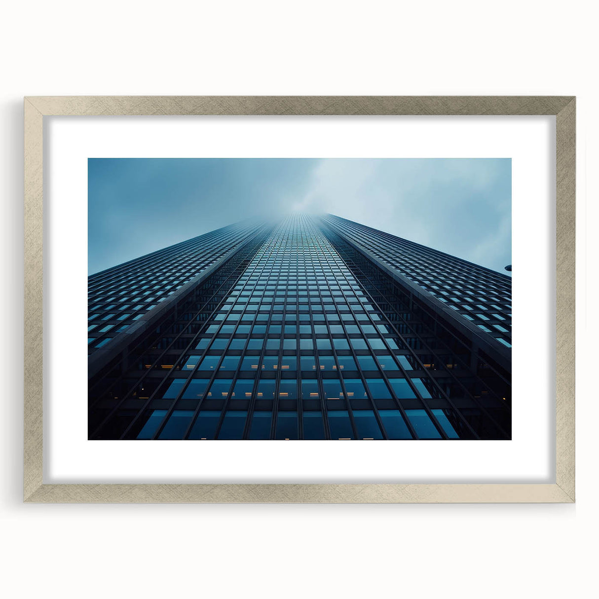 Abstract art print of a skyscraper, featuring silver and gray tones on a framed canvas, suitable for dining room decor.