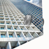 Large abstract wall art featuring a close-up of a skyscraper in muted gray tones on acrylic glass.