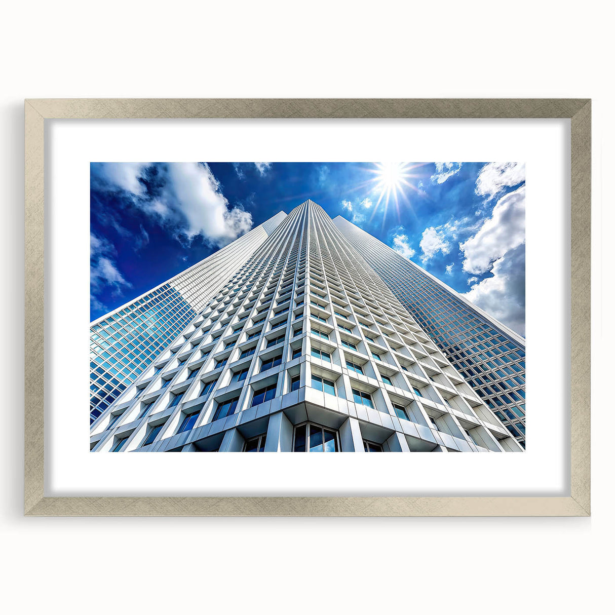 Abstract art print of skyscrapers in silver frame, using muted gray tones, ideal for modern bedroom or dining room decor.