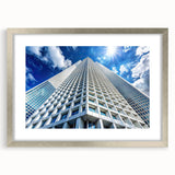Abstract art print of skyscrapers in silver frame, using muted gray tones, ideal for modern bedroom or dining room decor.