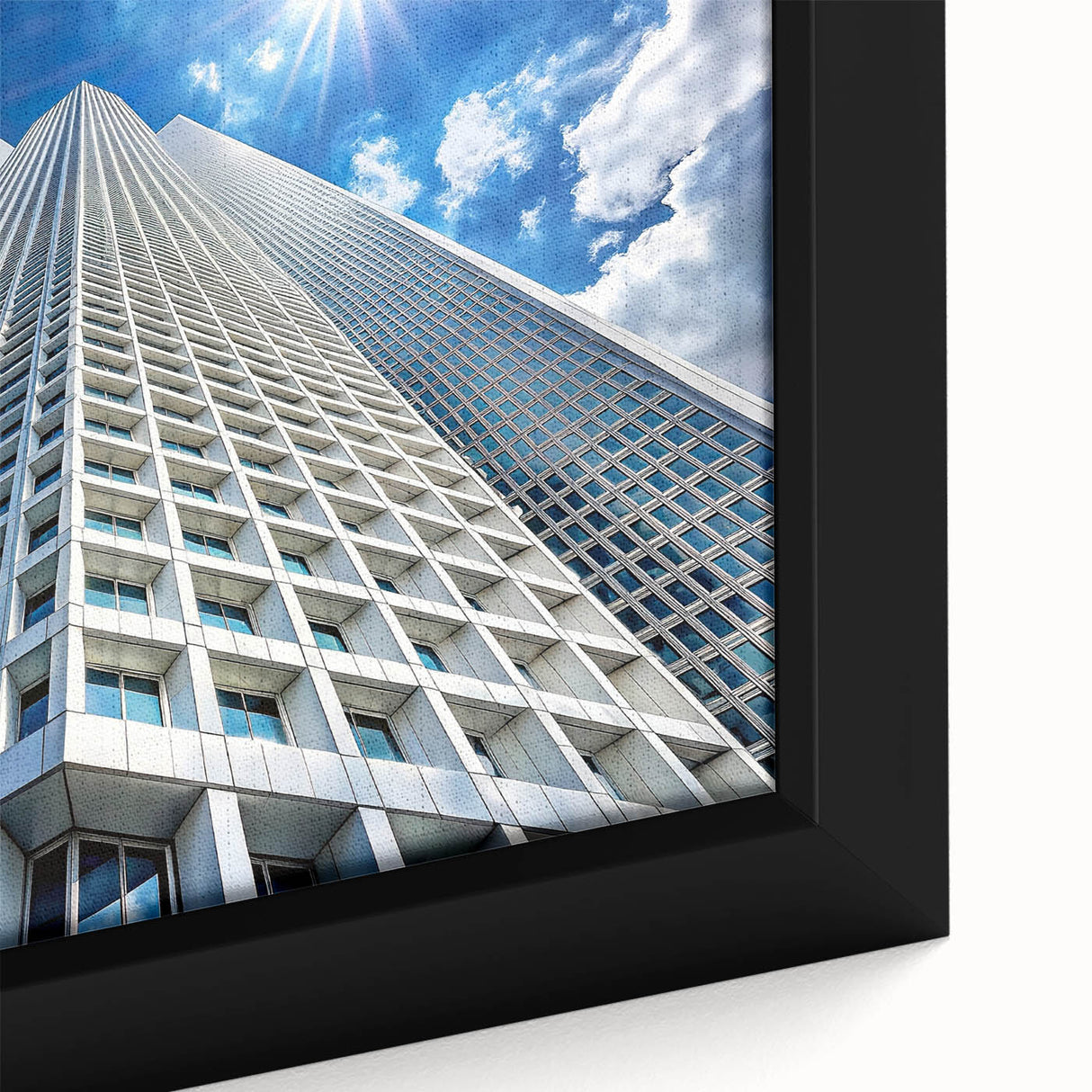 Close-up of a black wall art featuring a textured skyscraper design in vibrant colors on a framed canvas.