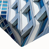 Black and white large art canvas depicting a close-up view of a skyscraper, ideal for bedroom wall decor.