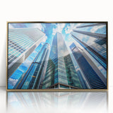 Mid-century modernist art depicting skyscrapers in muted gold tones on a framed acrylic, suitable for modern art wall decor.