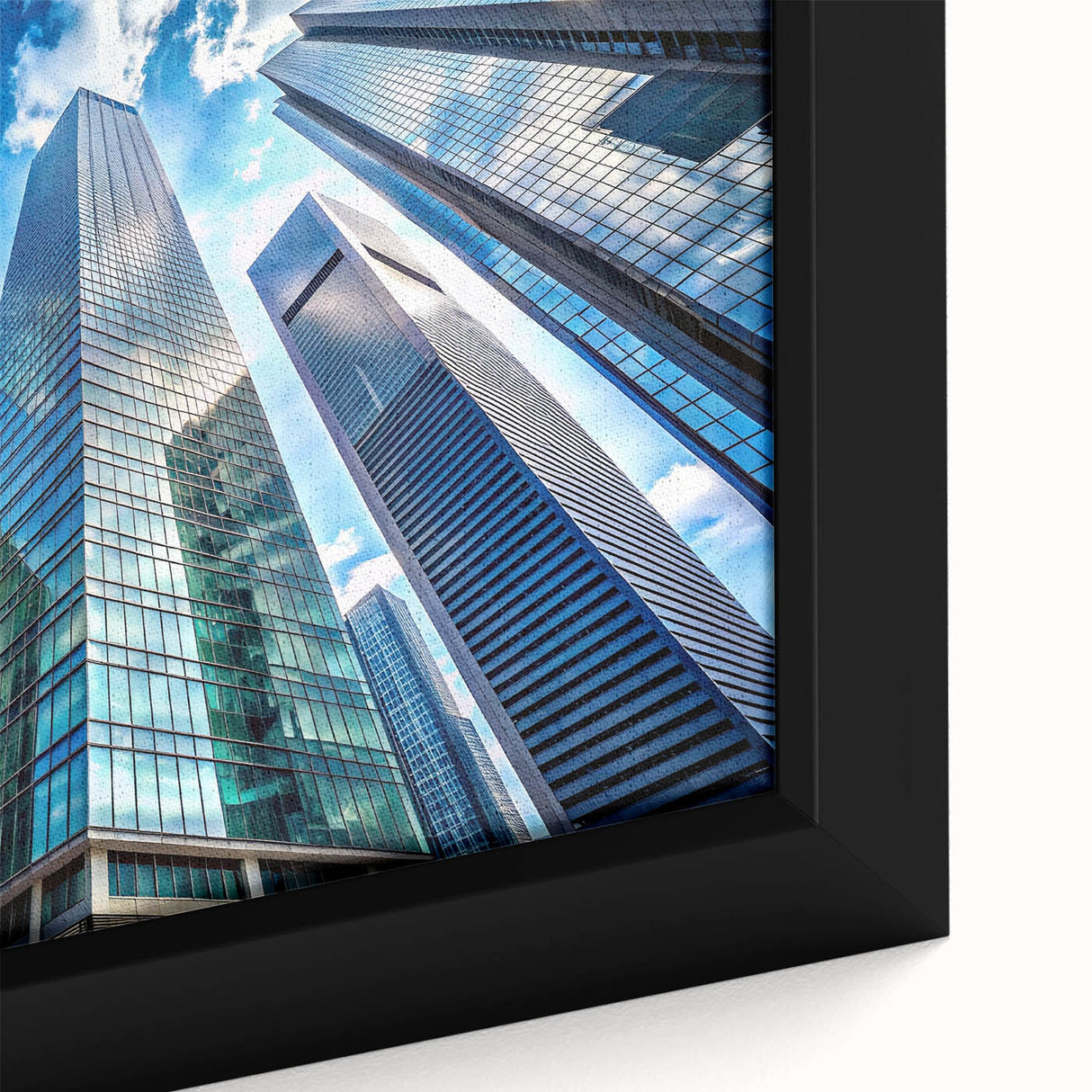 Black wall art of a skyscraper design on a framed canvas, featuring a textured, colorful art palette.