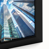 Black wall art of a skyscraper design on a framed canvas, featuring a textured, colorful art palette.