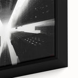 Close-up of a black wall art framed canvas featuring a textured, colorful skyscraper design, ideal for living room decor.