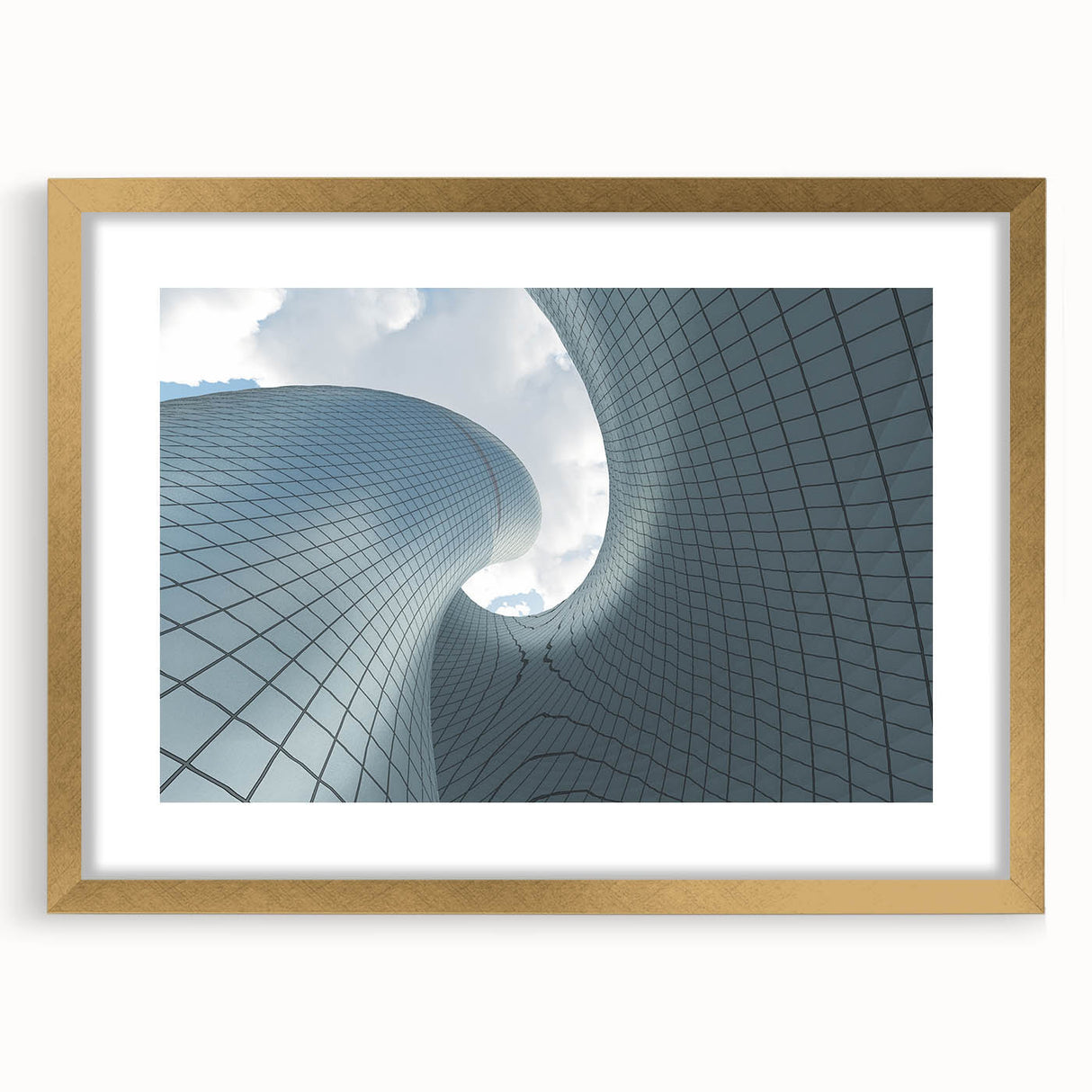 Textured art print of abstract skyscrapers in muted gray, framed in gold, ideal for modern bedroom decor.