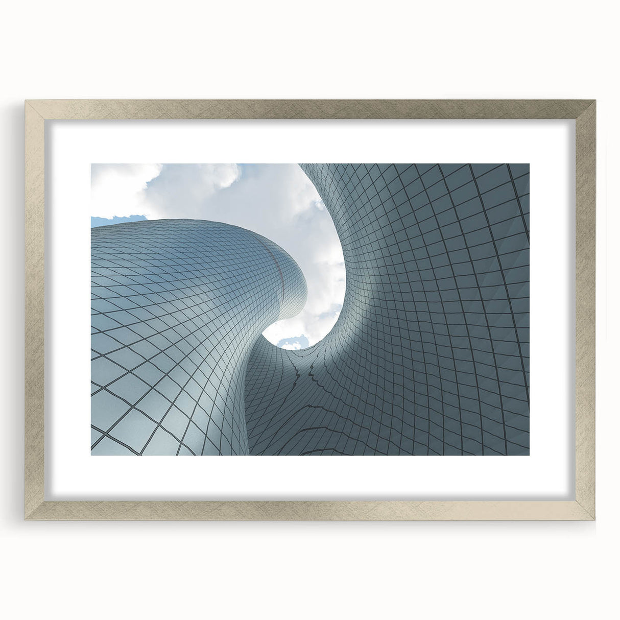 Abstract art print of a skyscraper, using muted gray and silver tones on a framed poster.