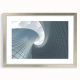 Abstract art print of a skyscraper, using muted gray and silver tones on a framed poster.
