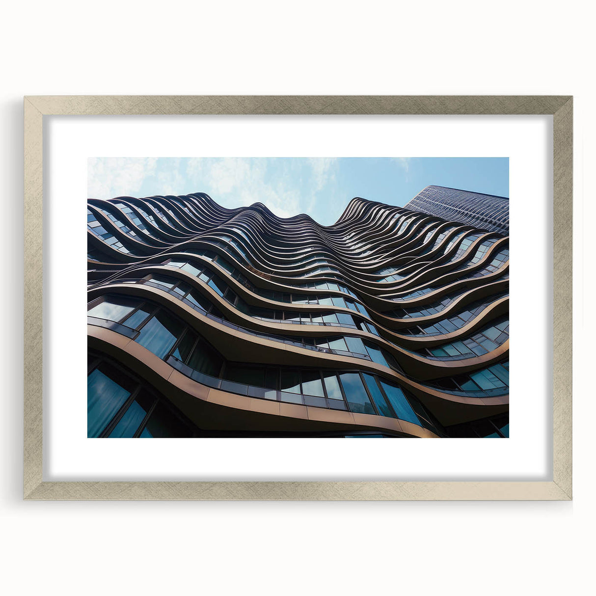 Abstract art print of skyscrapers in muted gray and blue tones, framed in silver, suitable for bedroom or dining room decor.