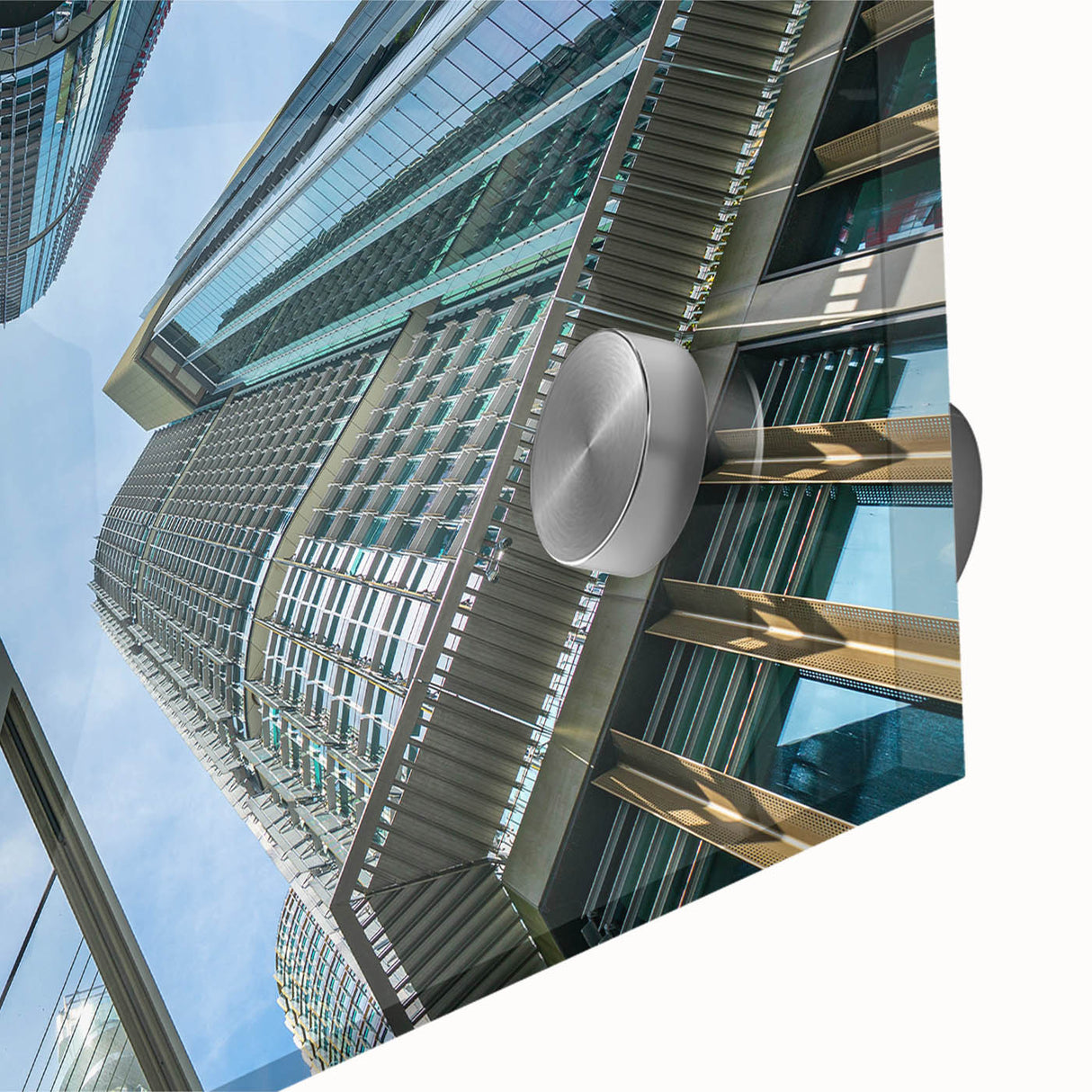 Acrylic glass print of a large abstract skyscraper design in gray tones.