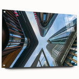 Large abstract wall art featuring a skyscraper design in muted grays and blues on acrylic glass.