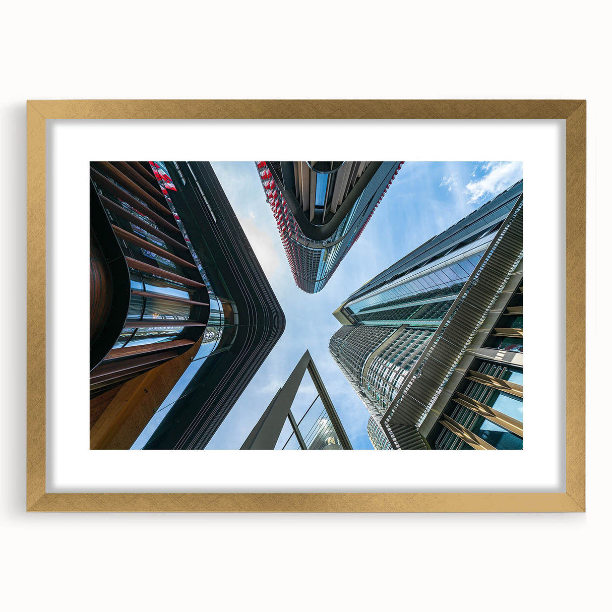 Textured art print of abstract skyscrapers in muted gray tones, framed in gold, ideal for modern bedroom ambiance.