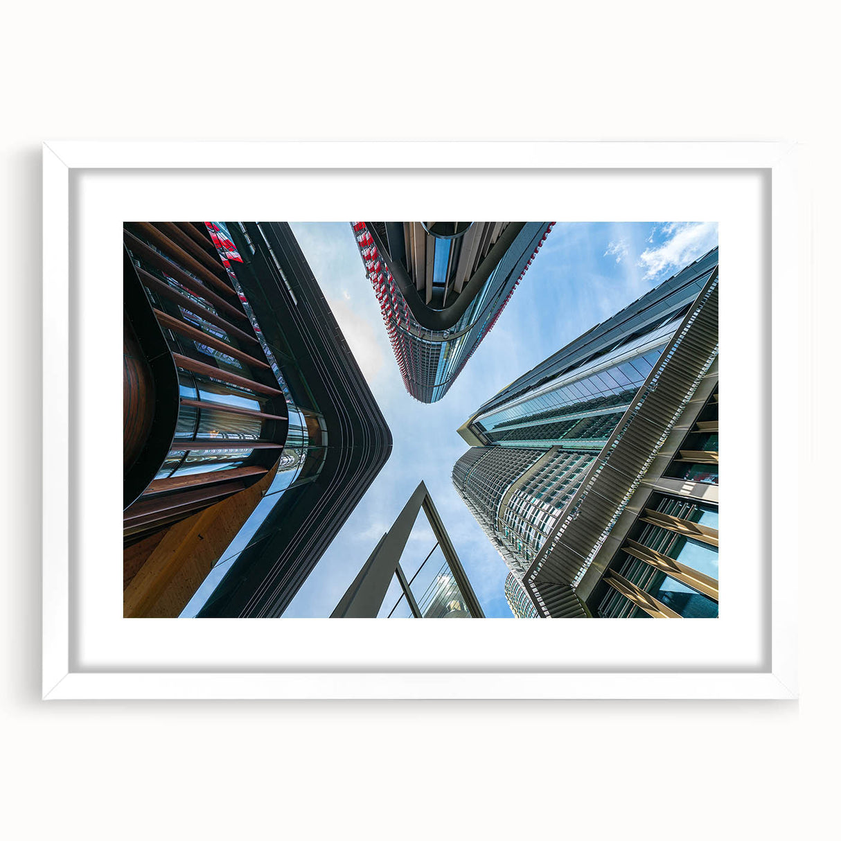 Extra large abstract art print of a textured skyscraper design in muted gray tones on a framed white mat.