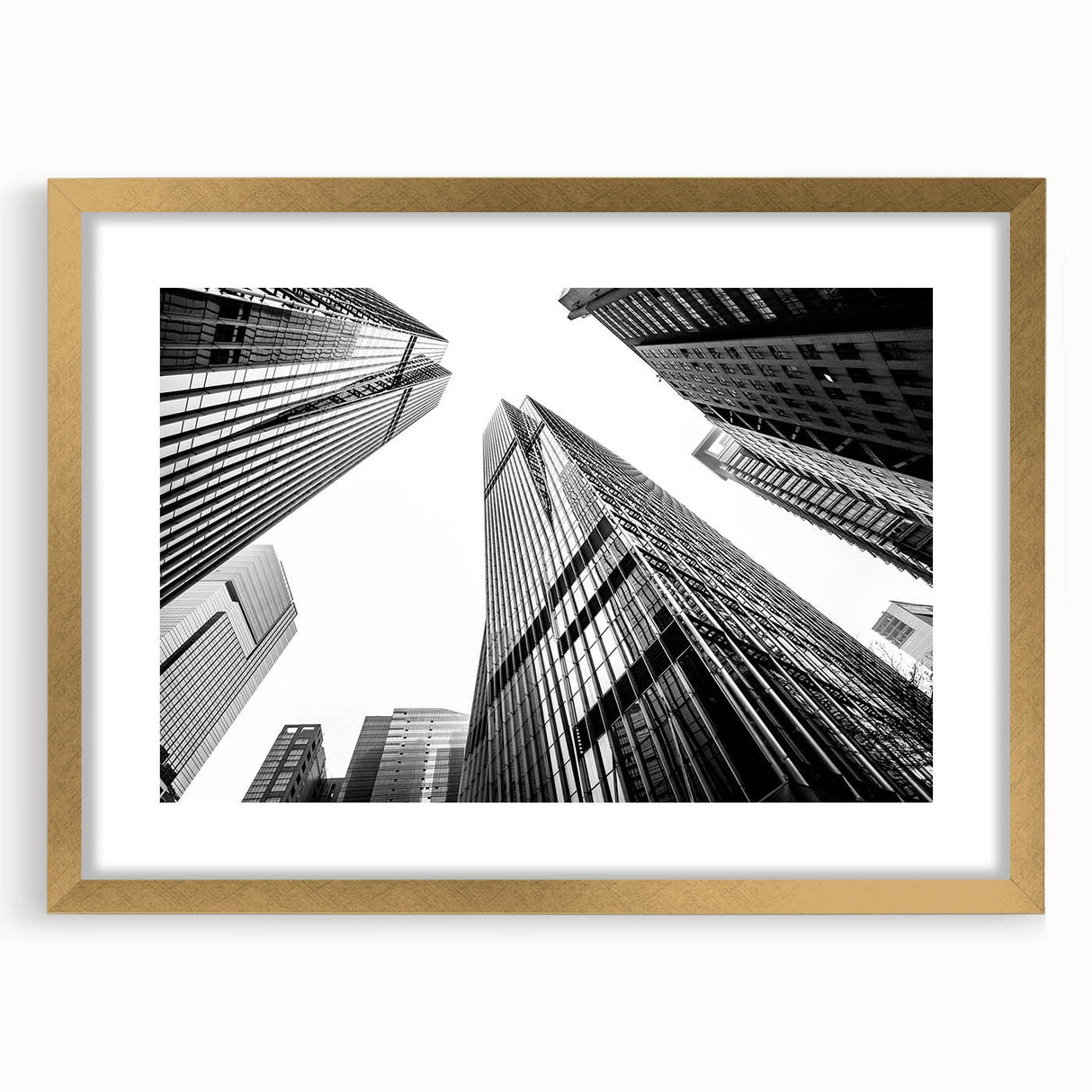 Textured abstract art print of skyscrapers in muted gray and gold tones on a framed canvas, suitable for bedroom decor.