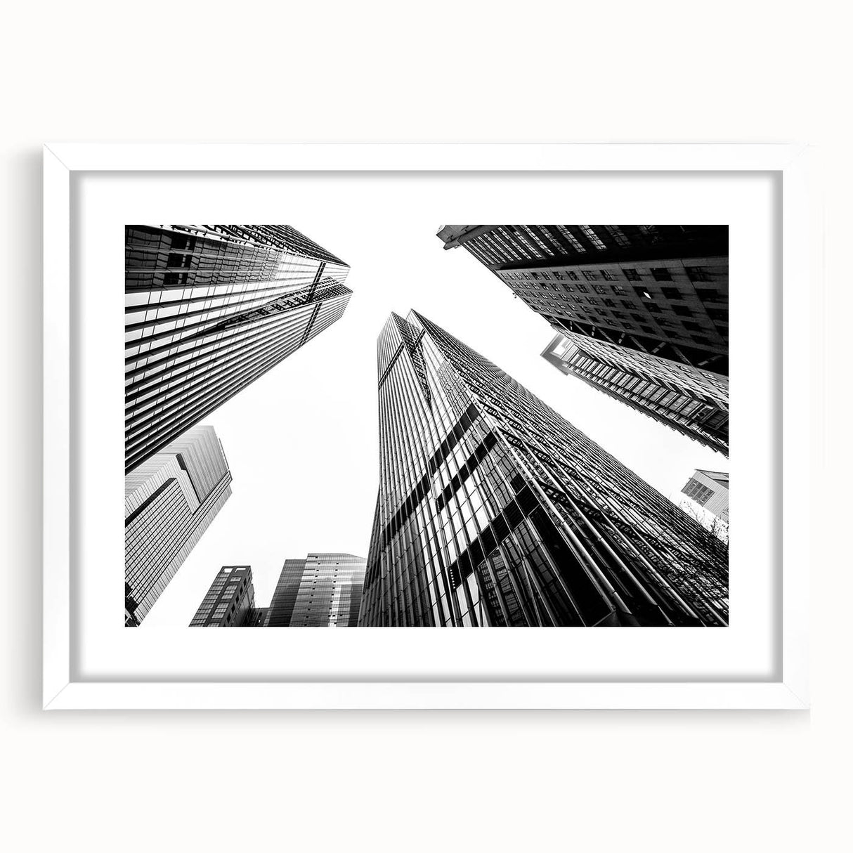 Extra large abstract art print featuring textured skyscraper design in muted grays, framed with a white mat.