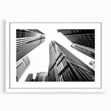 Extra large abstract art print featuring textured skyscraper design in muted grays, framed with a white mat.