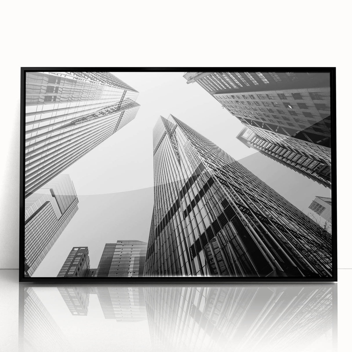 Large abstract wall art featuring a black and white skyscraper design on a framed acrylic, suitable for modern office decor.