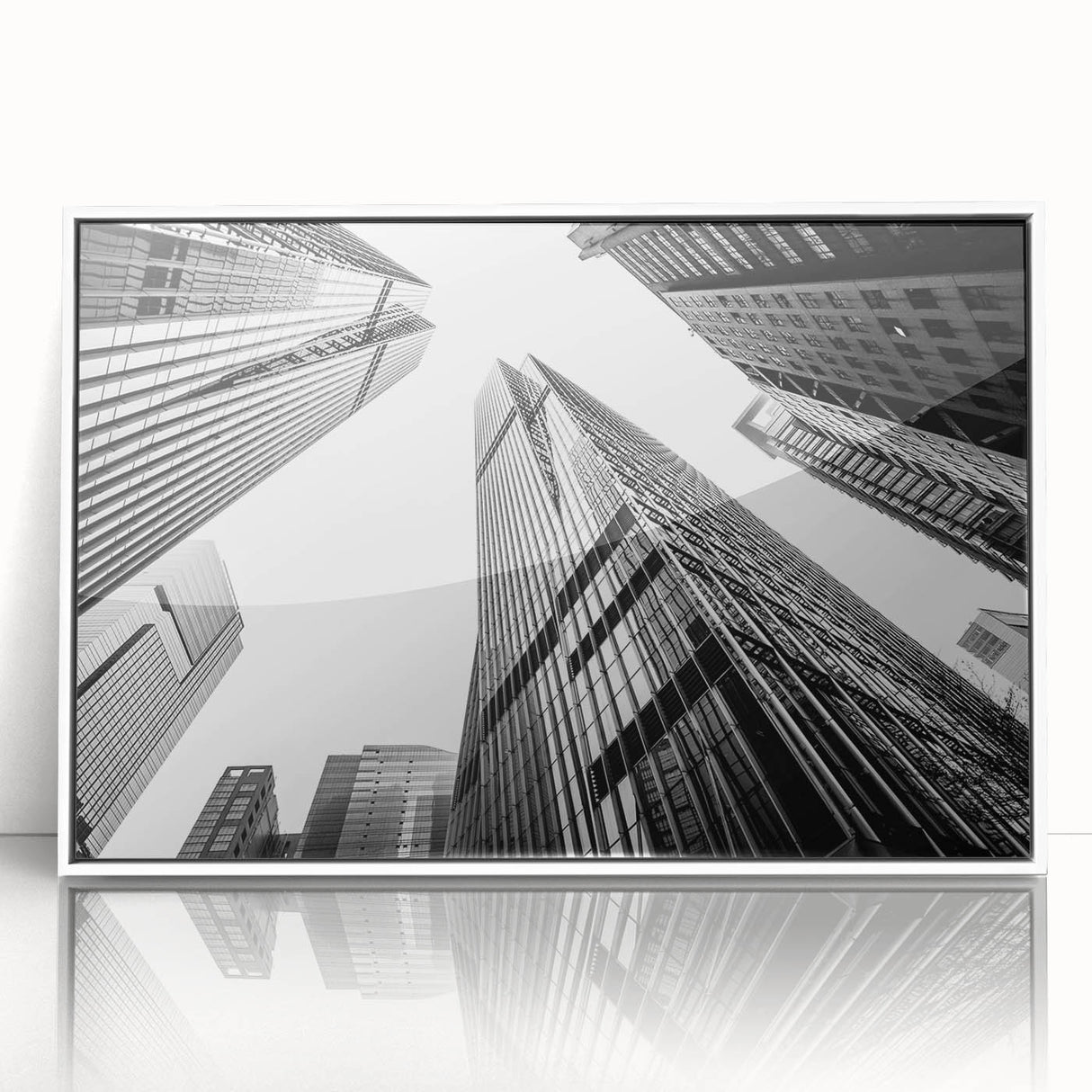 Mid-century modernist skyscraper design in black and gray on a white acrylic framed print.