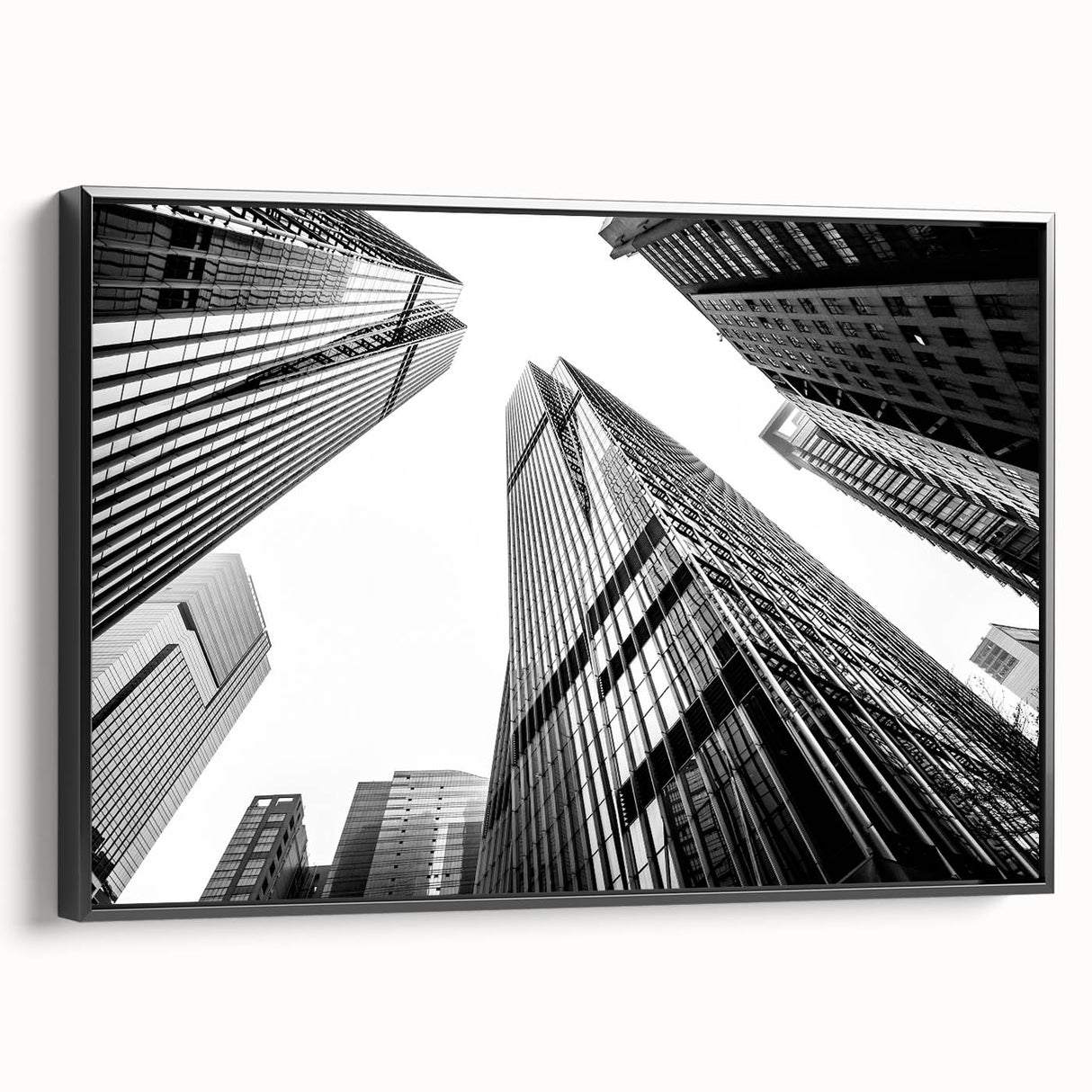 Black and white framed canvas of skyscraper architecture, ideal for bedroom wall art in a vintage poster style.