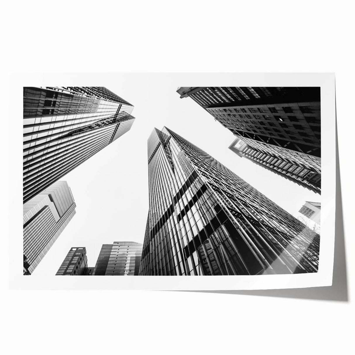 Rolled print of a skyscraper design in muted gray tones, suitable as extra large wall art for a dining room.