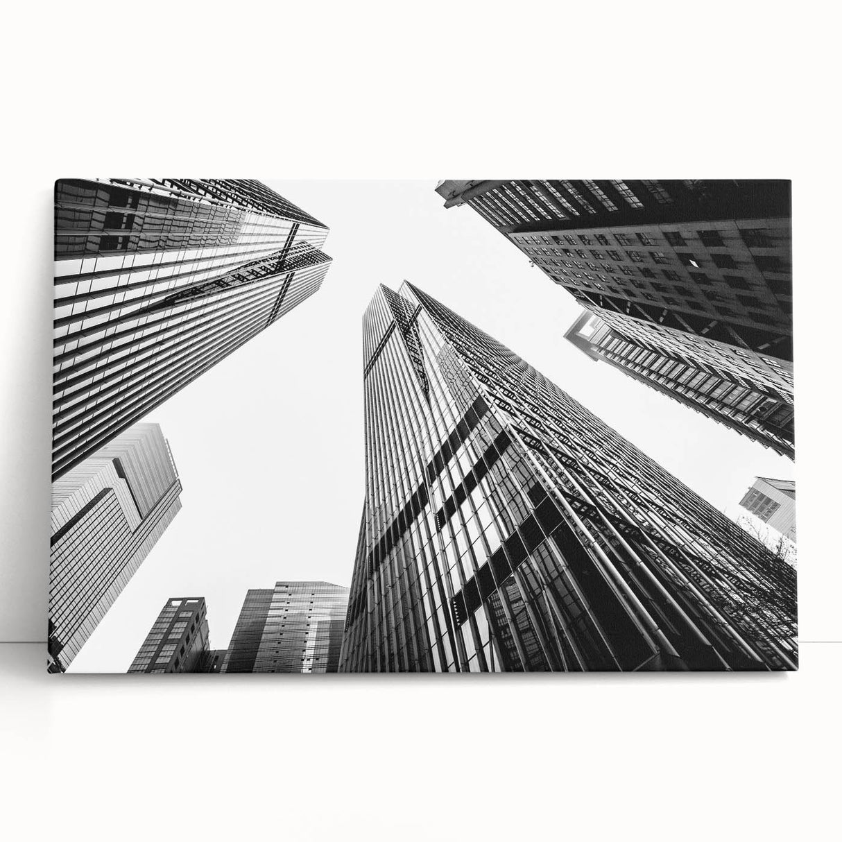 Black and white photo of skyscrapers on stretched canvas, ideal for kitchen wall art or bedroom ambiance.