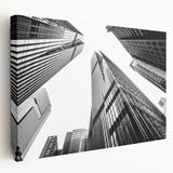 Large art print of modern skyscrapers on stretched canvas, showing detailed architectural designs in monochrome.