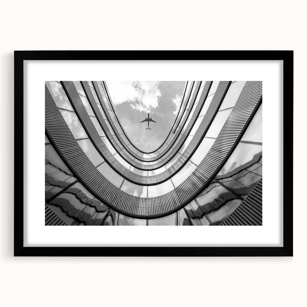 Extra large abstract art print featuring vibrant, textured skyscraper designs on a framed black matte canvas.
