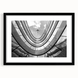 Extra large abstract art print featuring vibrant, textured skyscraper designs on a framed black matte canvas.