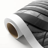 Art Deco-style skyscraper design in monochrome shades on rolled canvas, suitable for nursery wall art.