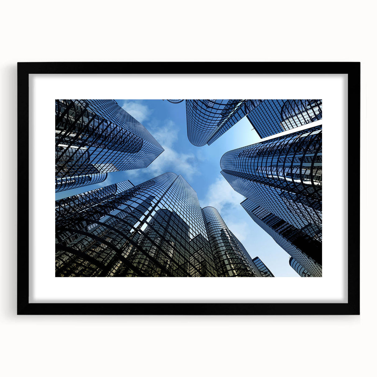 Extra large abstract art print featuring colorful, textured skyscraper designs on a black framed canvas.