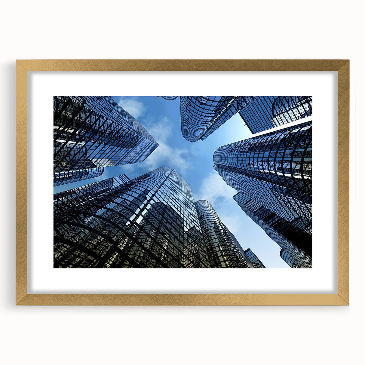 Textured art of abstract skyscraper design in gold frame with mat, featuring gray and metallic tones.