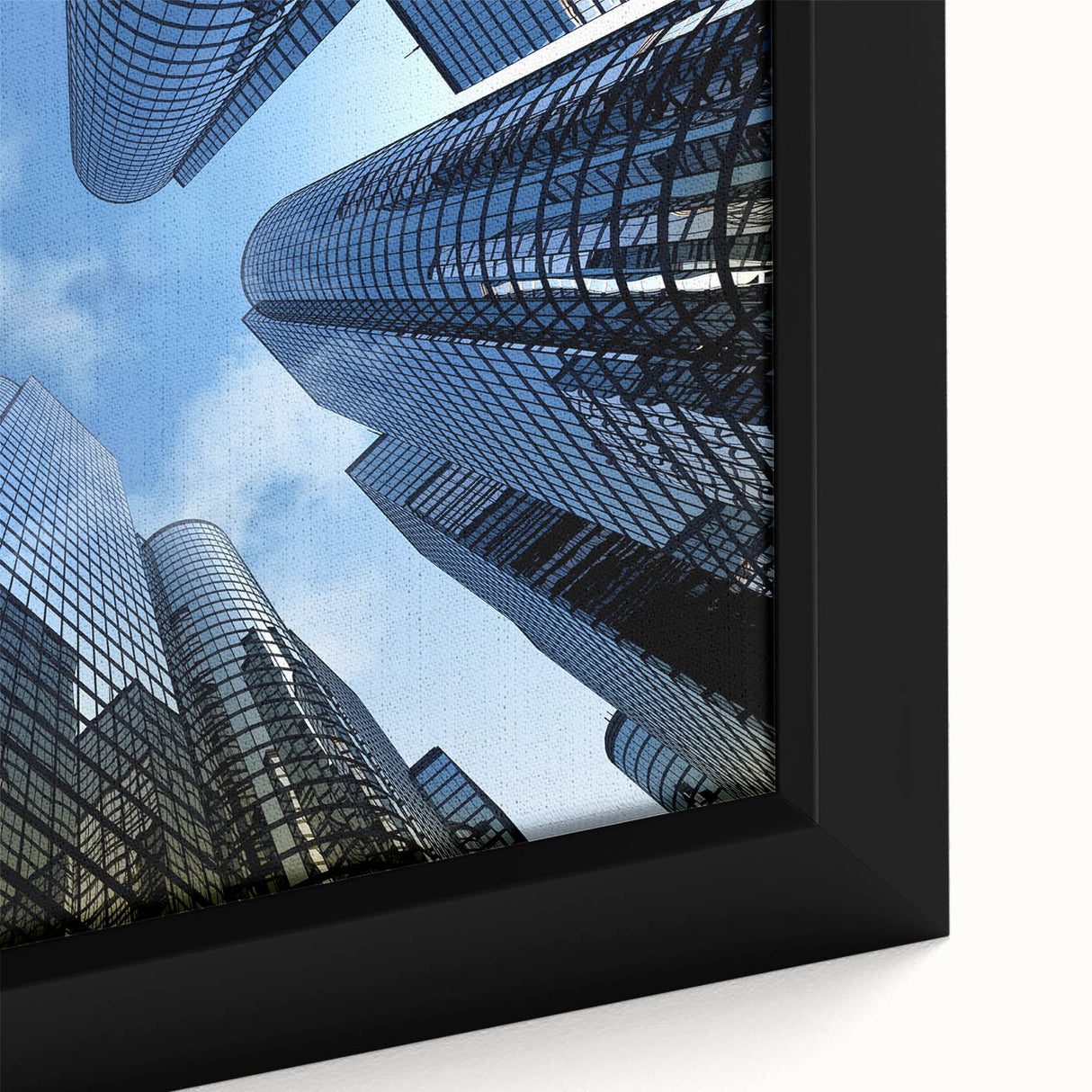 Extra large framed canvas featuring a close-up of a skyscraper, textured in black with colorful accents.