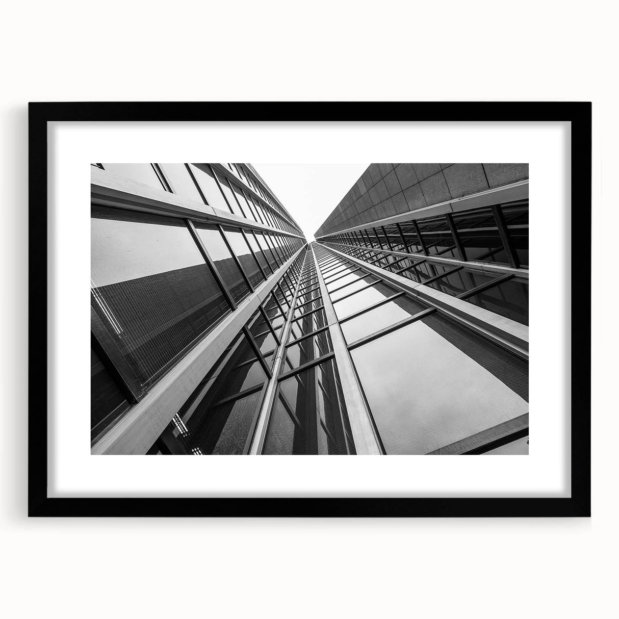 Extra large abstract art print featuring colorful, textured skyscraper designs on a framed black mat.