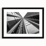 Extra large abstract art print featuring colorful, textured skyscraper designs on a framed black mat.