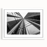 Extra large abstract art print featuring a textured skyscraper design in muted gray, framed with a white mat.